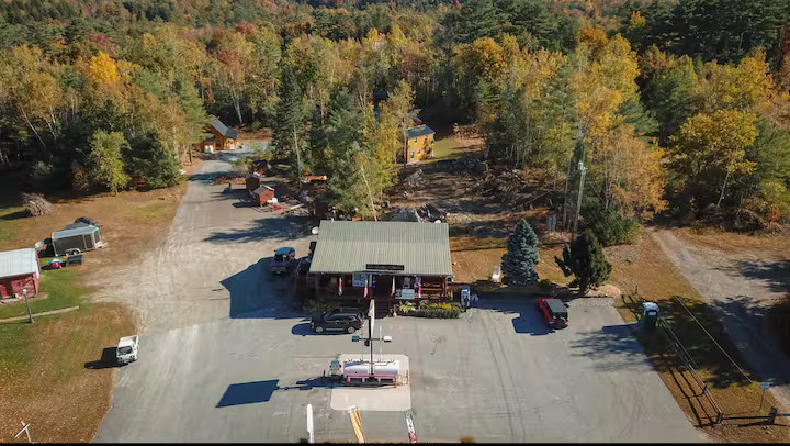 Aerial view of Swiftwater Way Station with cabins in the background