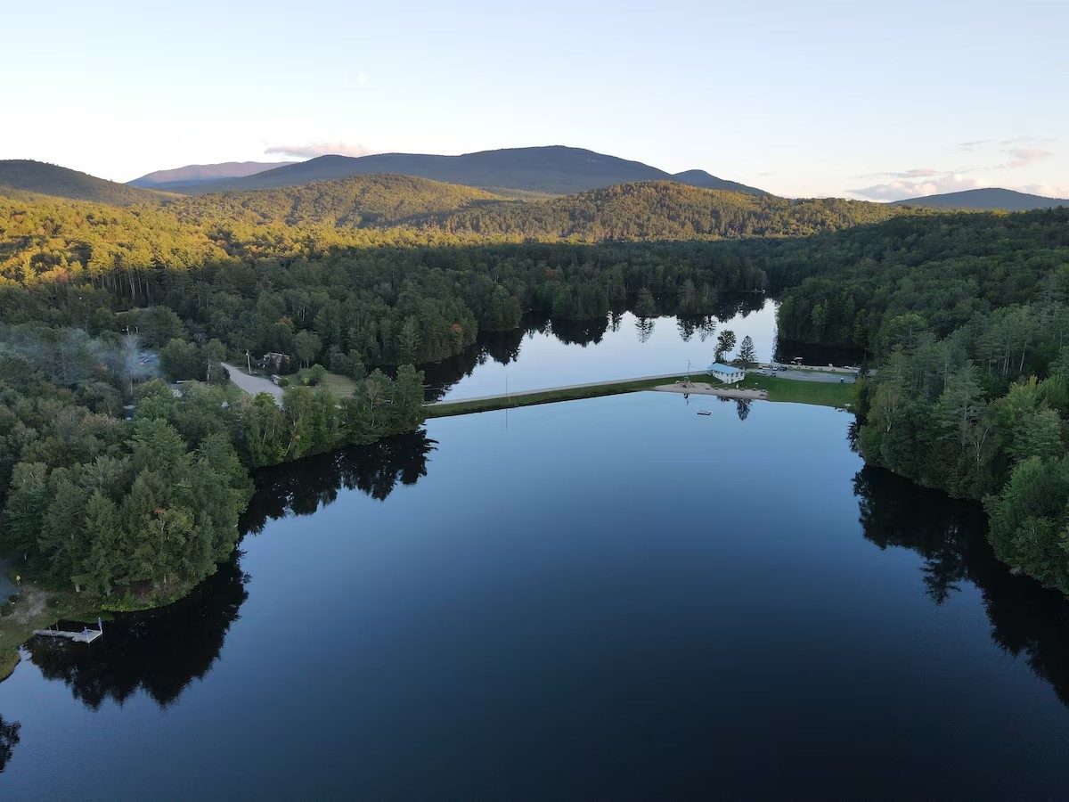 Aerial view of lake and White Mountains near Bath NH