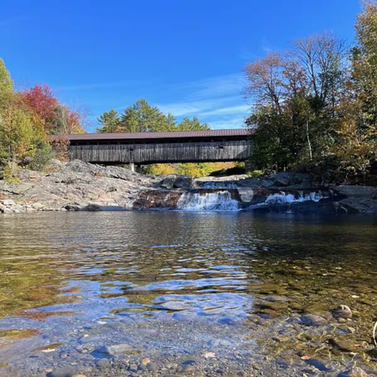 Covered bridge and river near Swiftwater Cabin Getaways